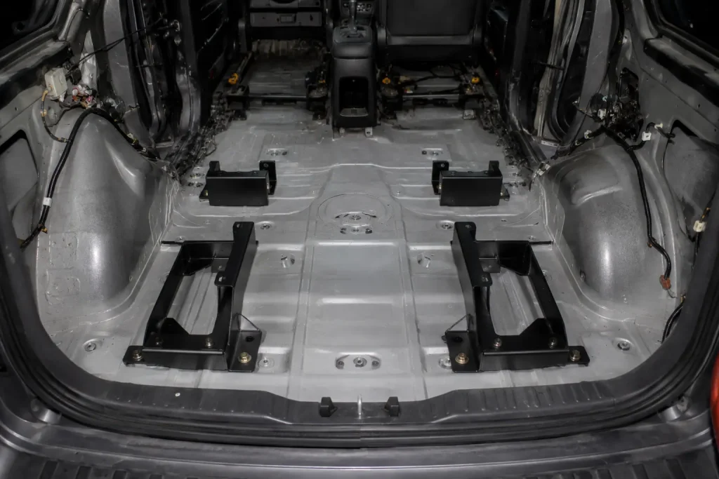 Workshop view of stripped vehicle interior